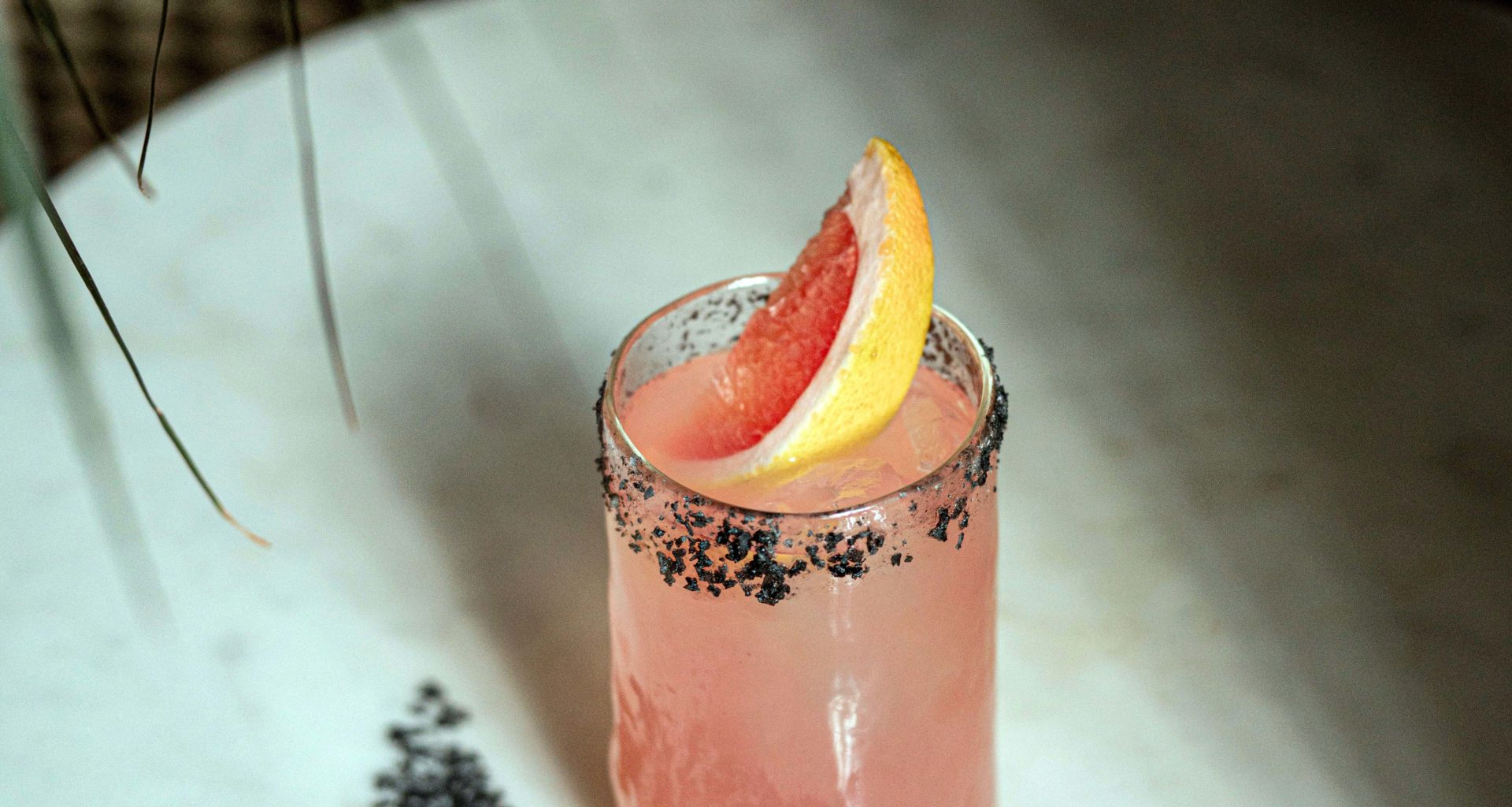 Pink Mezcal Cocktail with grapefruit slice